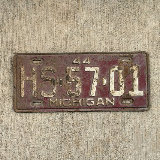 Photo of a 1944 Michigan License Plate Auto Tag Garage Decor Vintage HS 57 01 with original patina