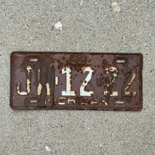 Photo of a 1944 Michigan License Plate Auto Tag Garage Decor Vintage JW 12 22 with original patina