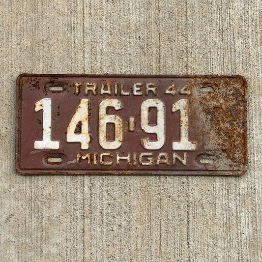 Photo of a 1944 Michigan Trailer License Plate Auto Tag Garage Decor Vintage 146 912 with original patina