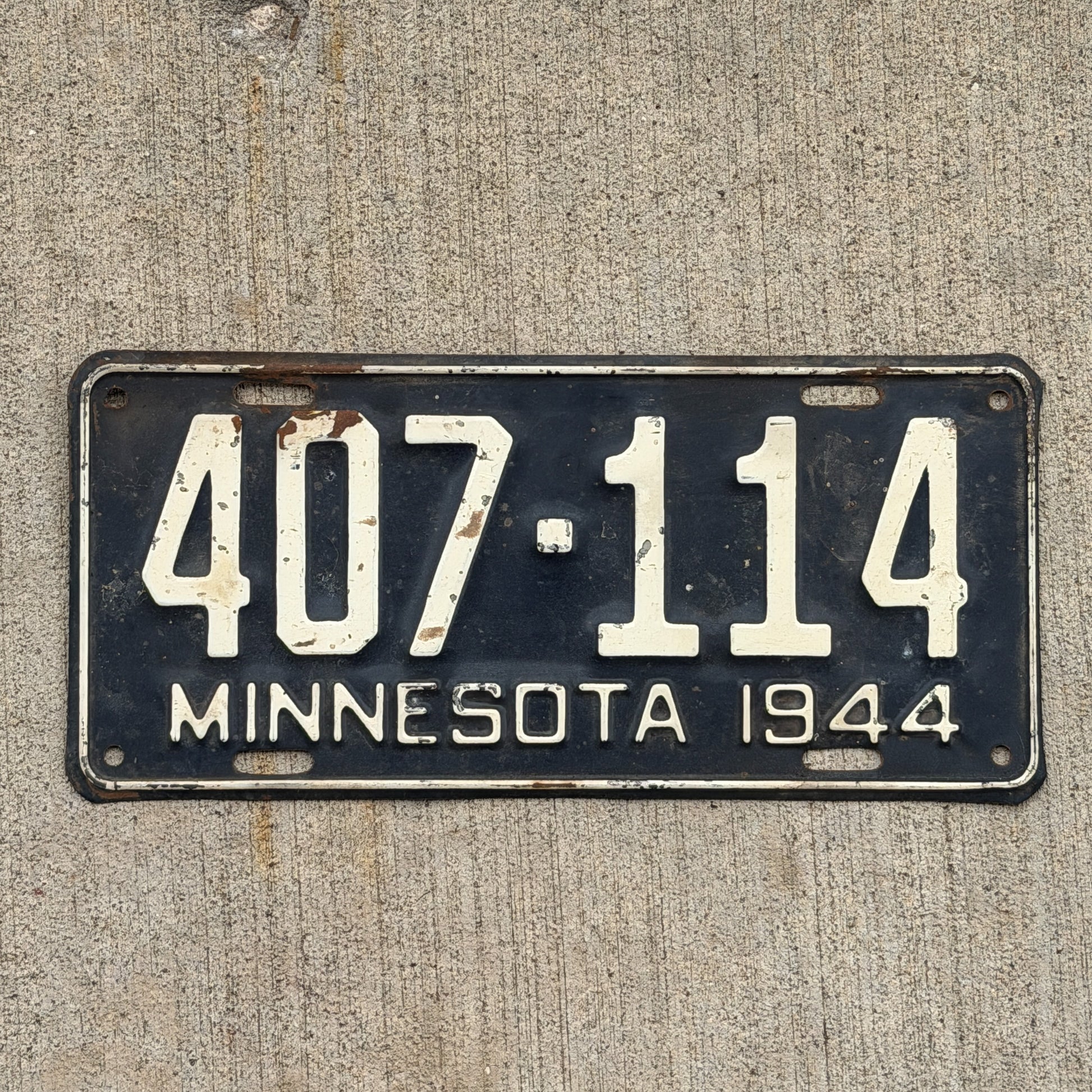 Photo of a 1944 Minnesota License Plate Auto Tag Garage Decor Vintage 407 114 with original patina