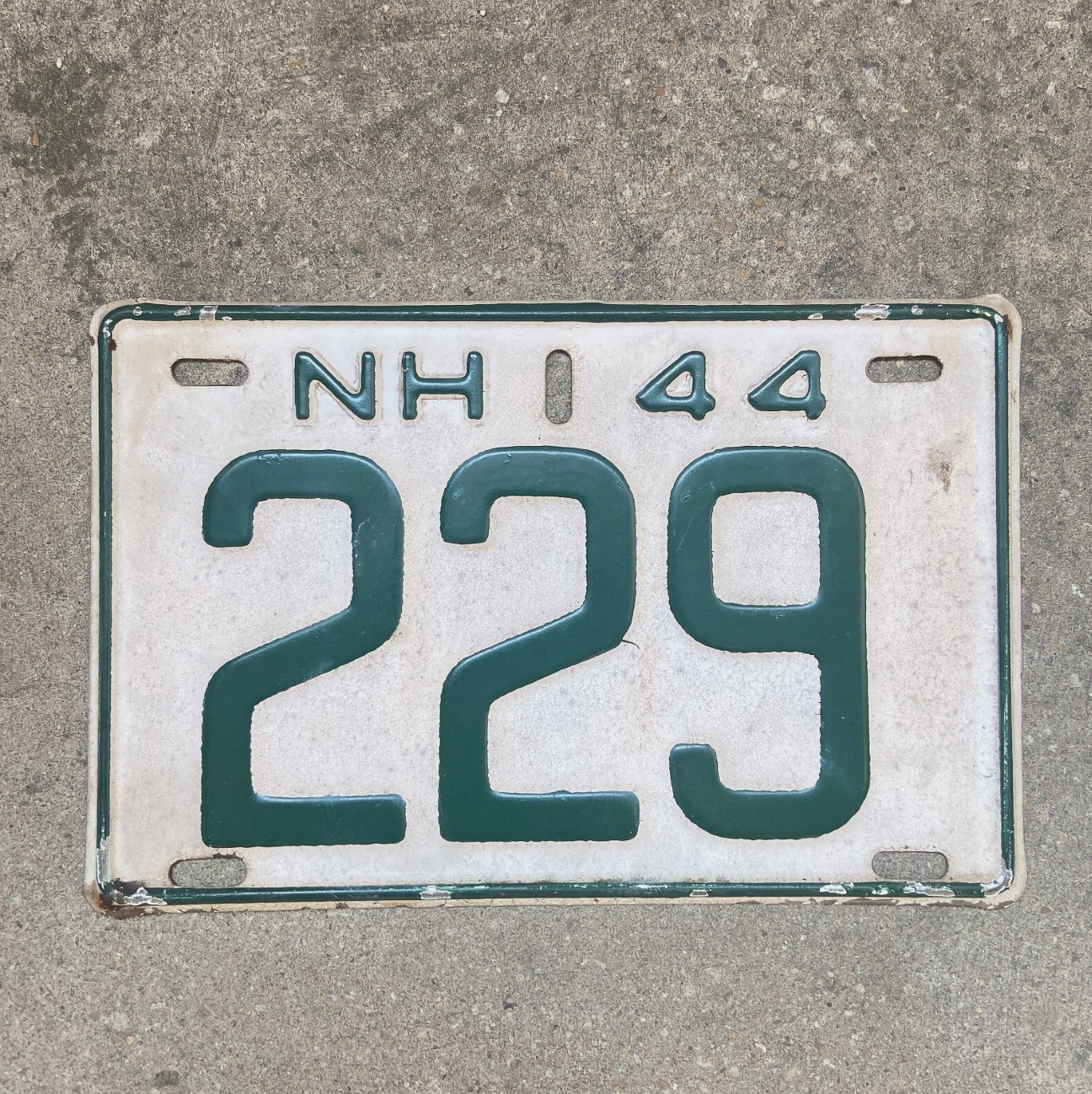 Photo of a 1944 New Hampshire License Plate Auto Tag Garage Decor Vintage Low Number Three Digit 229 with original patina