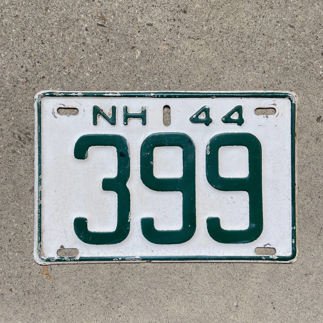Photo of a 1944 New Hampshire License Plate Auto Tag Garage Decor Vintage Low Number Three Digit 399 with original patina