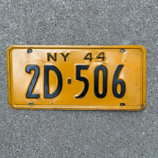 Photo of a 1944 New York License Plate Auto Tag Garage Decor Vintage Restamped War Year 2D 506 with original patina
