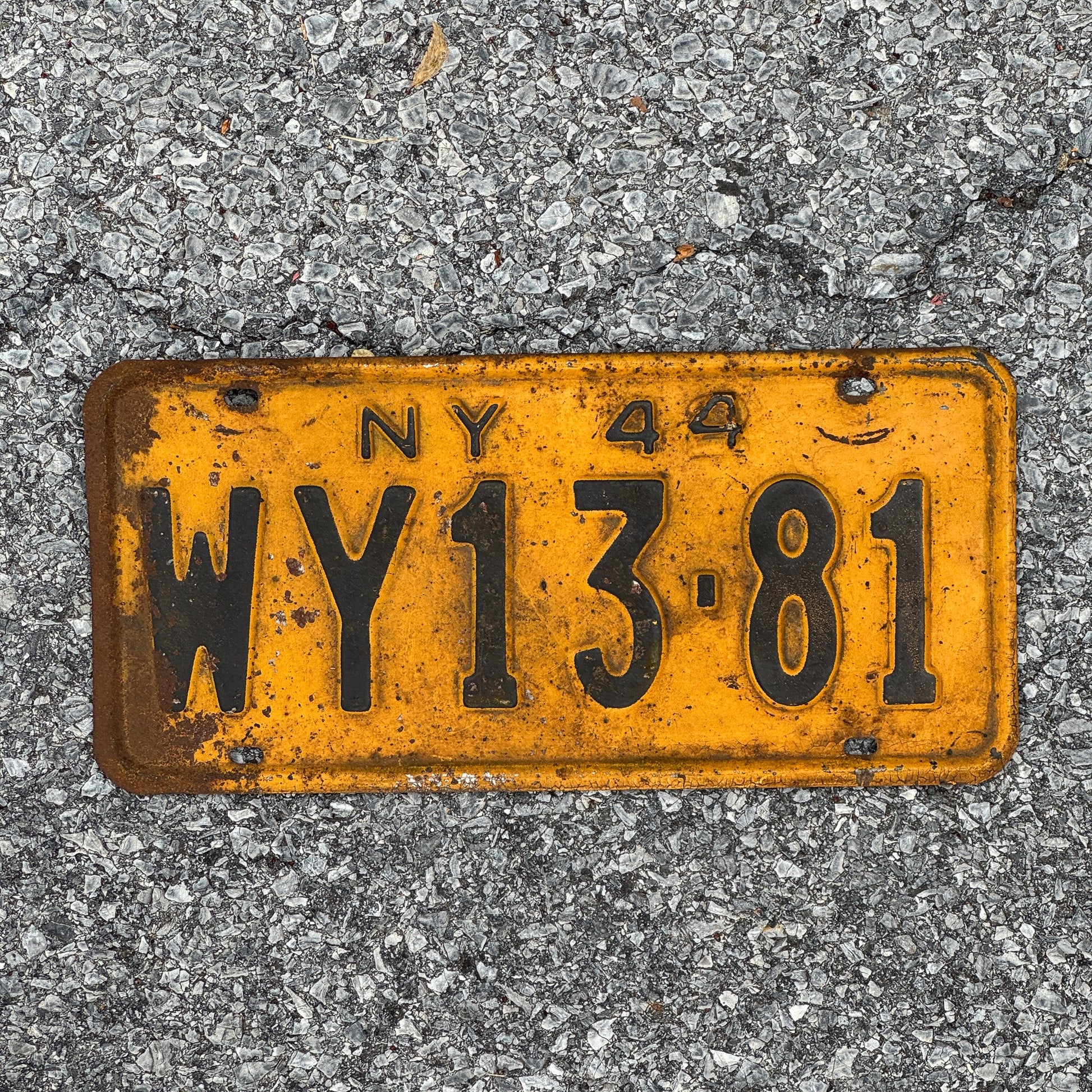 Photo of a 1944 New York License Plate Auto Tag Garage Decor Vintage Wyoming County Restamp WWII WY13 81
