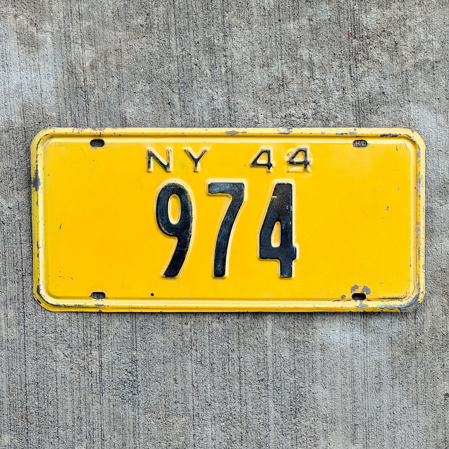 Photo of a 1944 New York Reserved License Plate Auto Tag Garage Decor Vintage Low Number Three Digit 974 with original patina