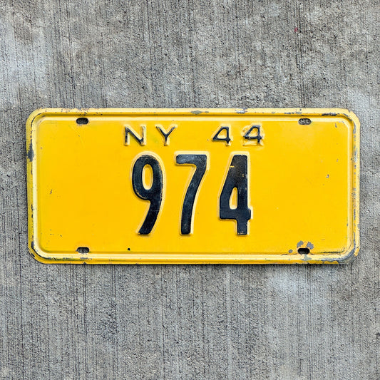 Photo of a 1944 New York Reserved License Plate Auto Tag Garage Decor Vintage Low Number Three Digit 974 with original patina