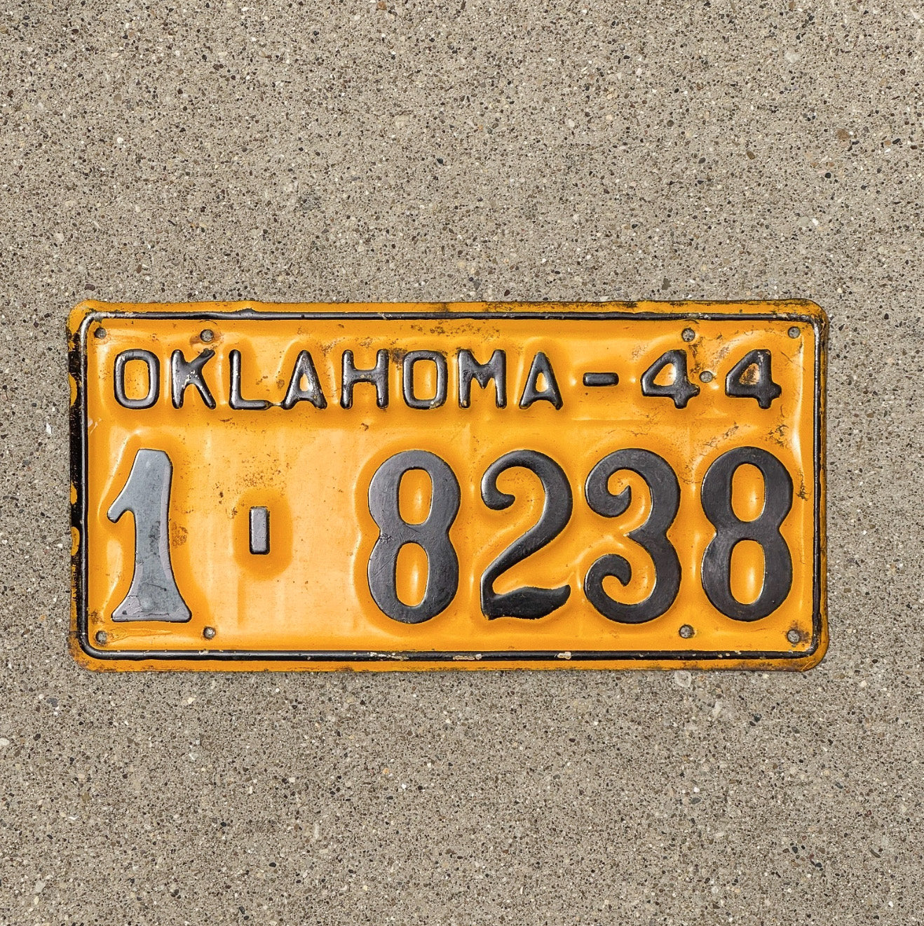 Photo of a 1944 Oklahoma License Plate Auto Tag Garage Decor Vintage 1 8238 with original patina