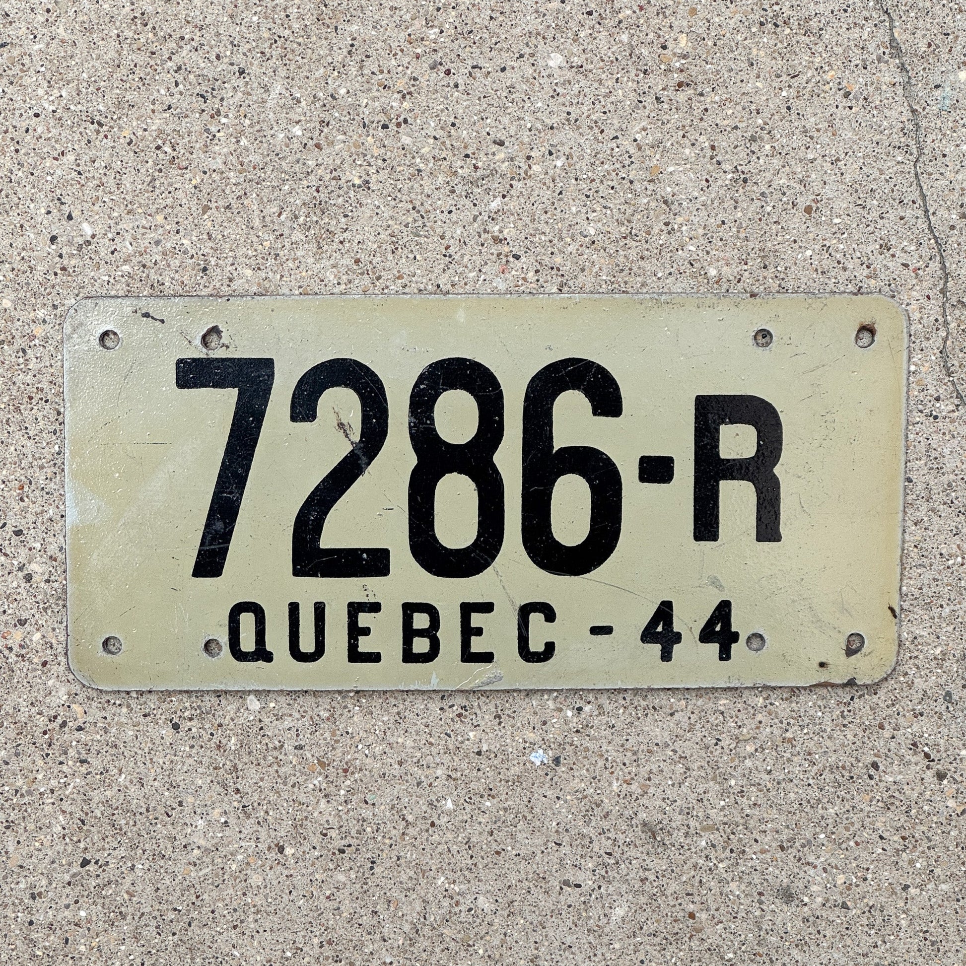 Photo of a 1944 Quebec Farm Trailer License Plate Auto Tag Garage Decor Vintage Fiberboard 7286 R with original patina