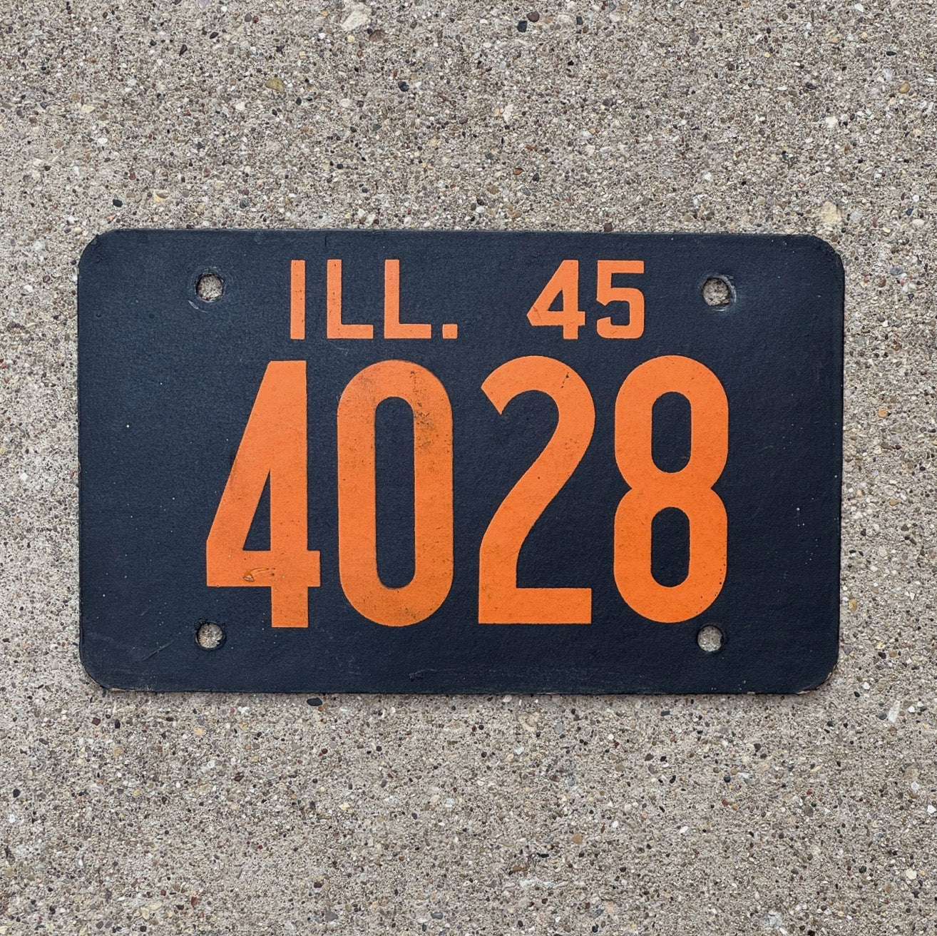 Photo of a 1945 Illinois Fiberboard License Plate Auto Tag Garage Decor Vintage Low Number Four Digit 4028 with original patina