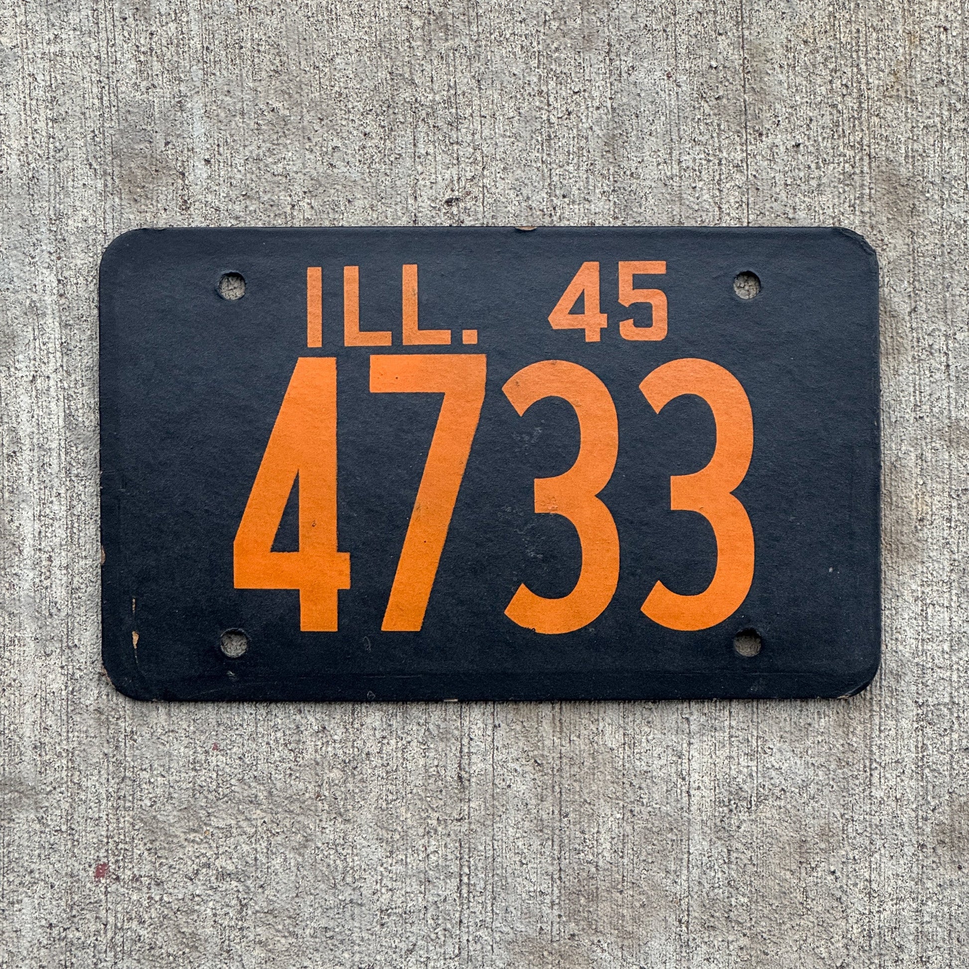 Photo of a 1945 Illinois License Plate Auto Tag Garage Decor Vintage Fiberboard Low Number Four Digit 4733 with original patina