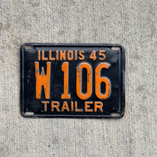 Photo of a 1945 Illinois Trailer License Plate Auto Tag Garage Decor Vintage Low Number Three Digit W 106 with original patina