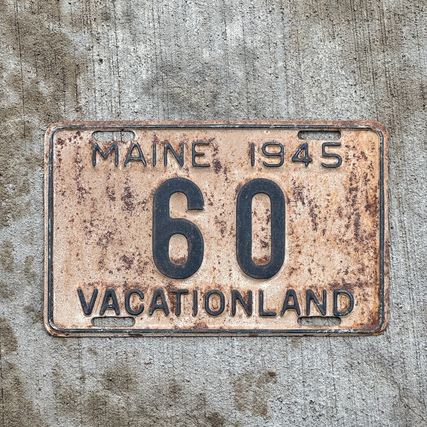 Photo of a 1945 Maine License Plate Auto Tag Garage Decor Vintage Low Number Two Digit 60 with original patina