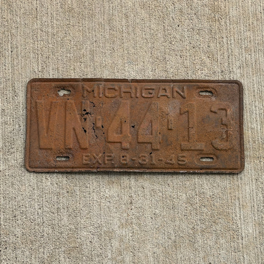 Photo of a 1945 Michigan License Plate Auto Tag Garage Decor Vintage Half Year VN 44 13 with original patina