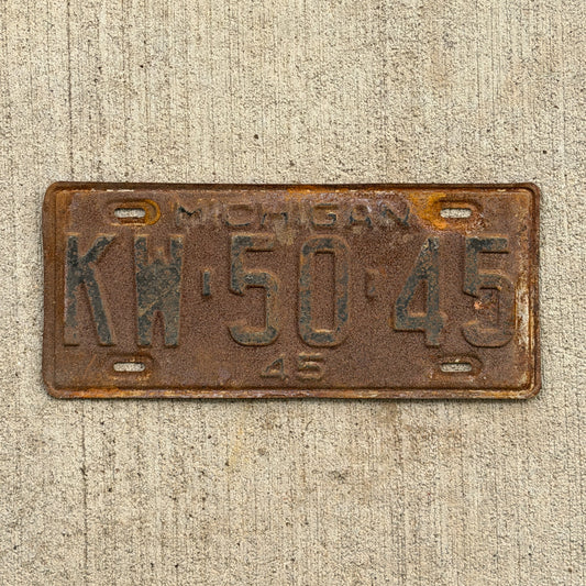 Photo of a 1945 Michigan License Plate Auto Tag Garage Decor Vintage KW 50 45 with original patina
