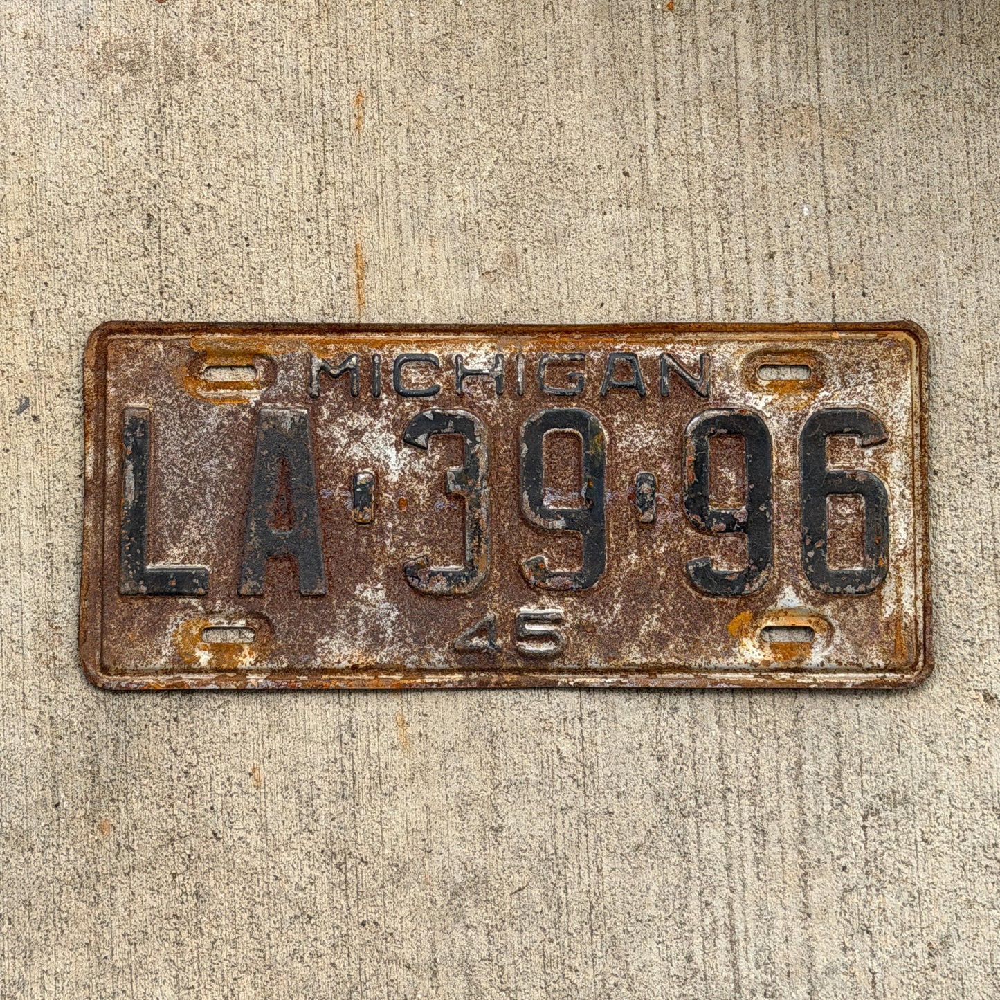 Photo of a 1945 Michigan License Plate Auto Tag Garage Decor Vintage LA 39 96 with original patina