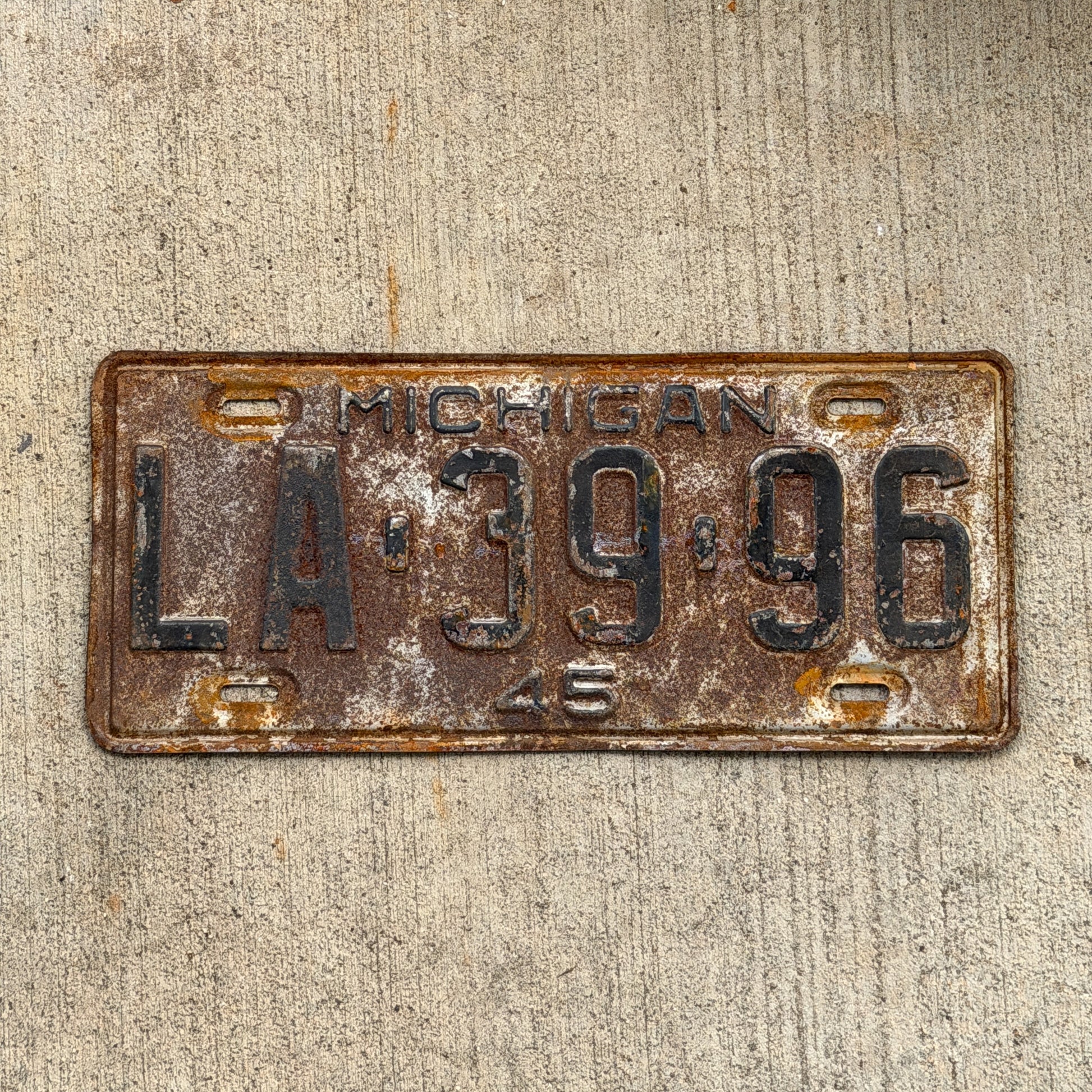 Photo of a 1945 Michigan License Plate Auto Tag Garage Decor Vintage LA 39 96 with original patina