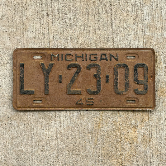 Photo of a 1945 Michigan License Plate Auto Tag Garage Decor Vintage LY 23 09 with original patina