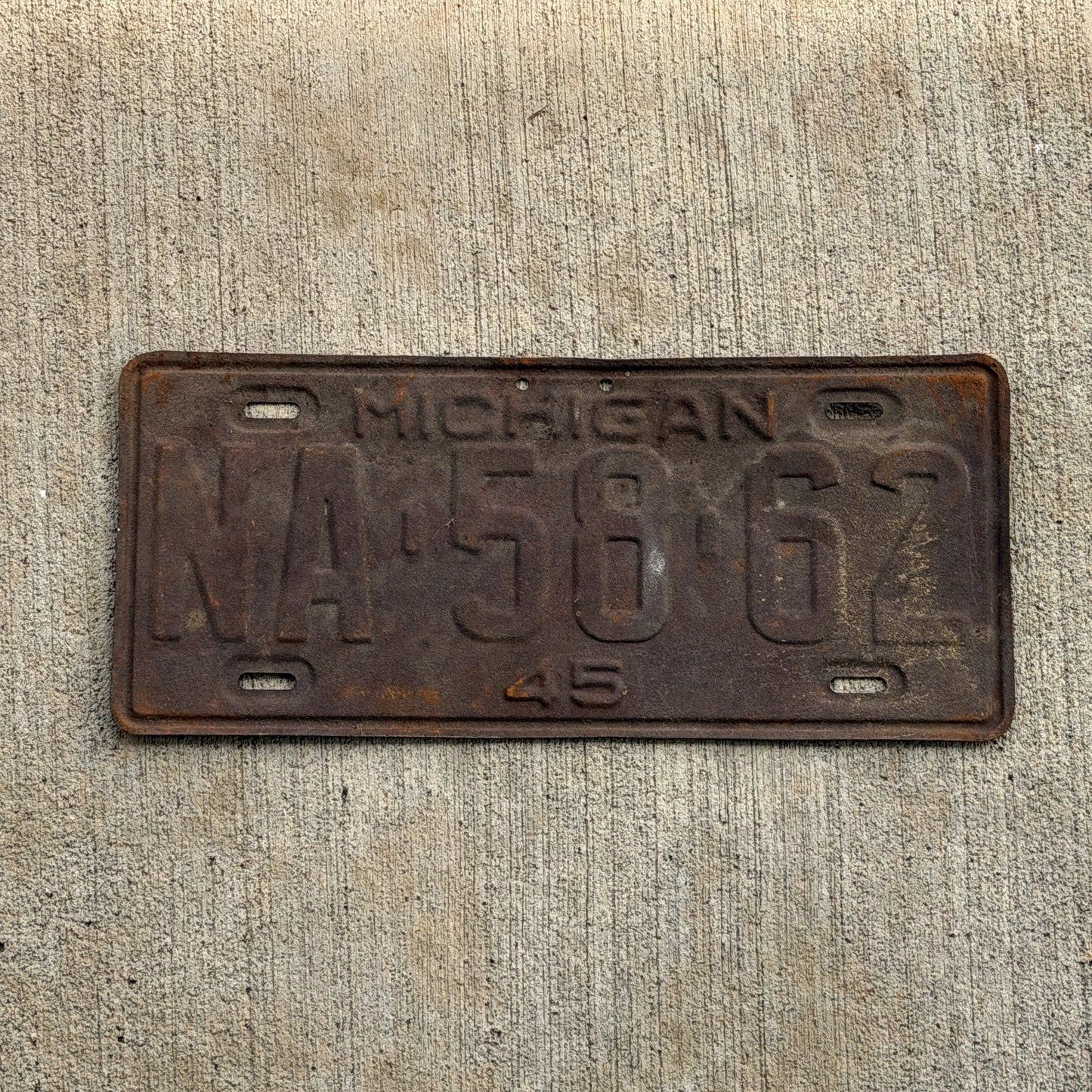 Photo of a 1945 Michigan License Plate Auto Tag Garage Decor Vintage NA 58 62 with original patina