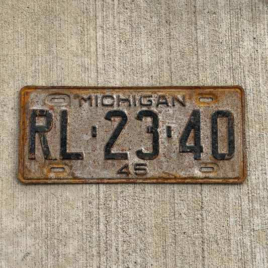 Photo of a 1945 Michigan License Plate Auto Tag Garage Decor Vintage RL 23 40 with original patina