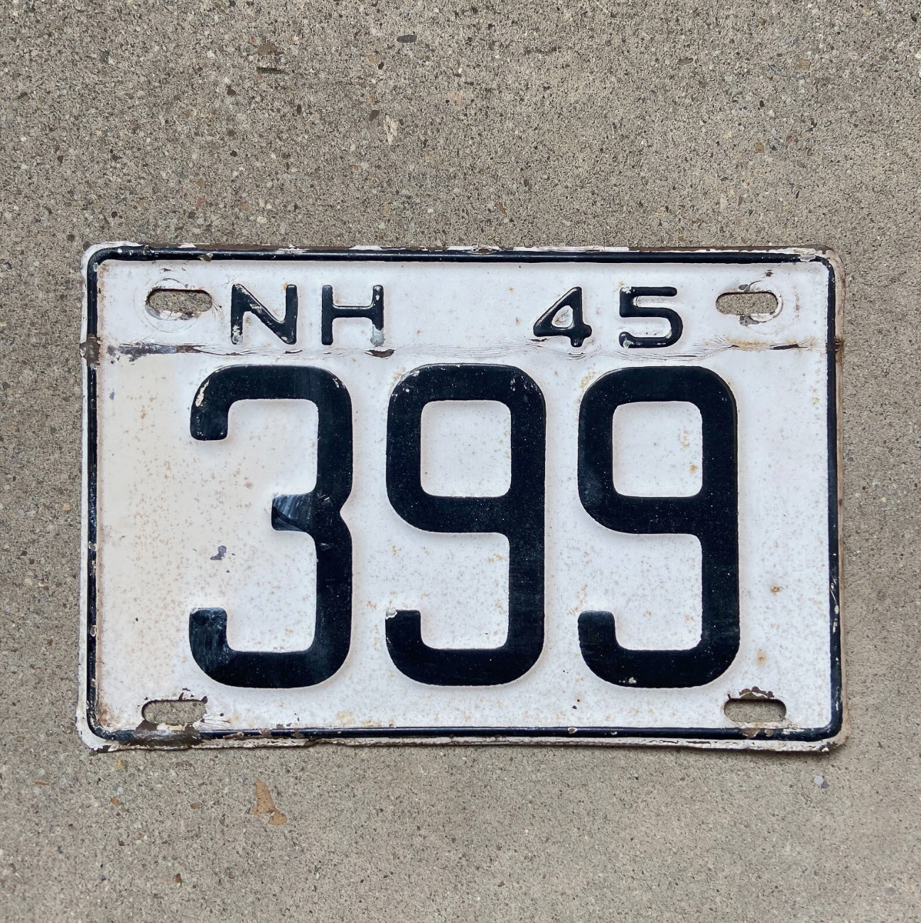 Photo of a 1945 New Hampshire License Plate Auto Tag Garage Decor Vintage Low Number Three Digit 399 with original patina