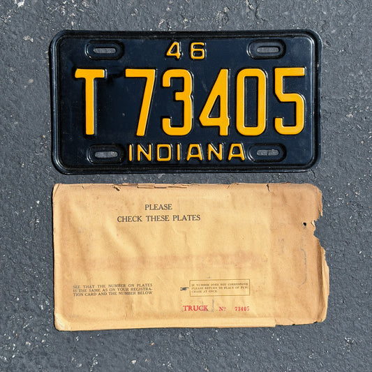 Photo of a 1946 Indiana Truck License Plate Auto Tag Garage Decor Vintage NOS With Envelope T 73405 with original patina