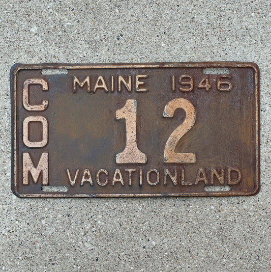 Photo of a 1946 Maine Truck License Plate Auto Tag Garage Decor Vintage Low Number Two Digit 12 with original patina