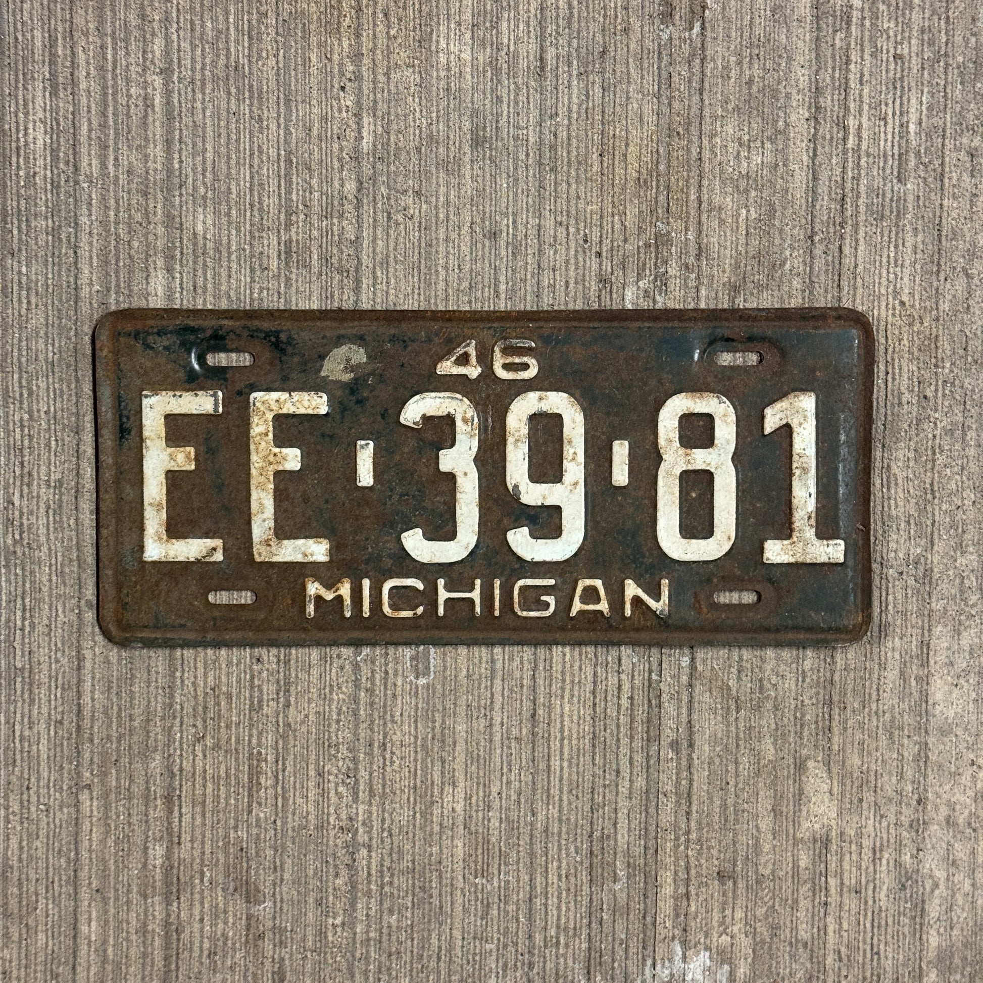 Photo of a 1946 Michigan Auto Tag Garage Decor Vintage EE 3981 with original patina