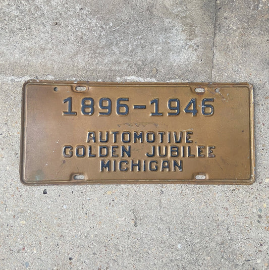 Photo of a 1946 Michigan Booster License Plate Auto Tag Garage Decor Vintage Automotive Golden Jubilee Antique Auto 1896 with original patina