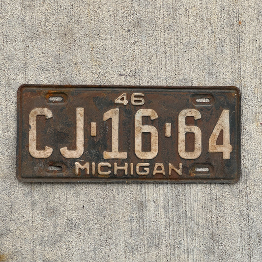 Photo of a 1946 Michigan License Plate Auto Tag Garage Decor Vintage CJ 16 64 with original patina