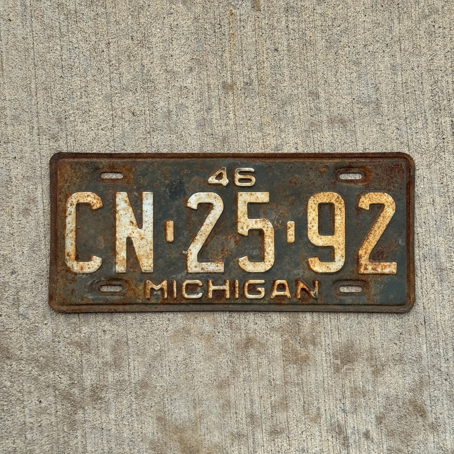 Photo of a 1946 Michigan License Plate Auto Tag Garage Decor Vintage CN 25 92 with original patina