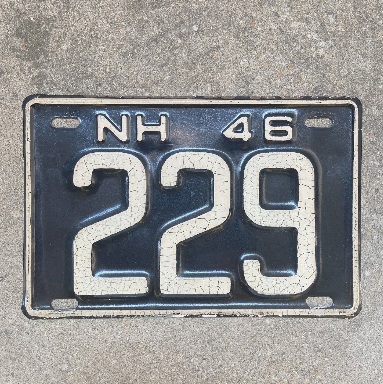 Photo of a 1946 New Hampshire License Plate Auto Tag Garage Decor Vintage Low Number Three Digit 229 with original patina