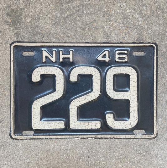 Photo of a 1946 New Hampshire License Plate Auto Tag Garage Decor Vintage Low Number Three Digit 229 with original patina
