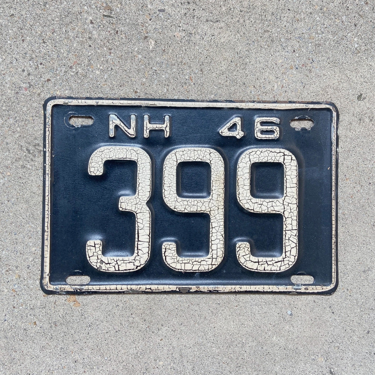 Photo of a 1946 New Hampshire License Plate Auto Tag Garage Decor Vintage Low Number Three Digit 399 with original patina