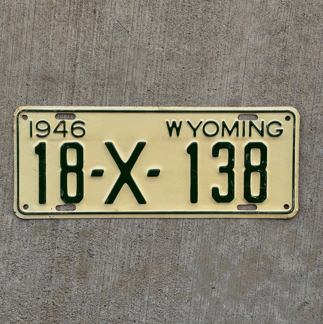 Photo of a 1946 Wyoming Trailer License Plate Auto Tag Garage Decor Vintage 18 X 138 with original patina