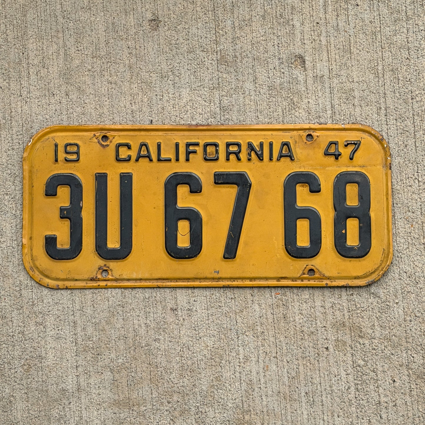 Photo of a 1947 California License Plate Auto Tag Garage Decor Vintage 3U 67 68 with original patina