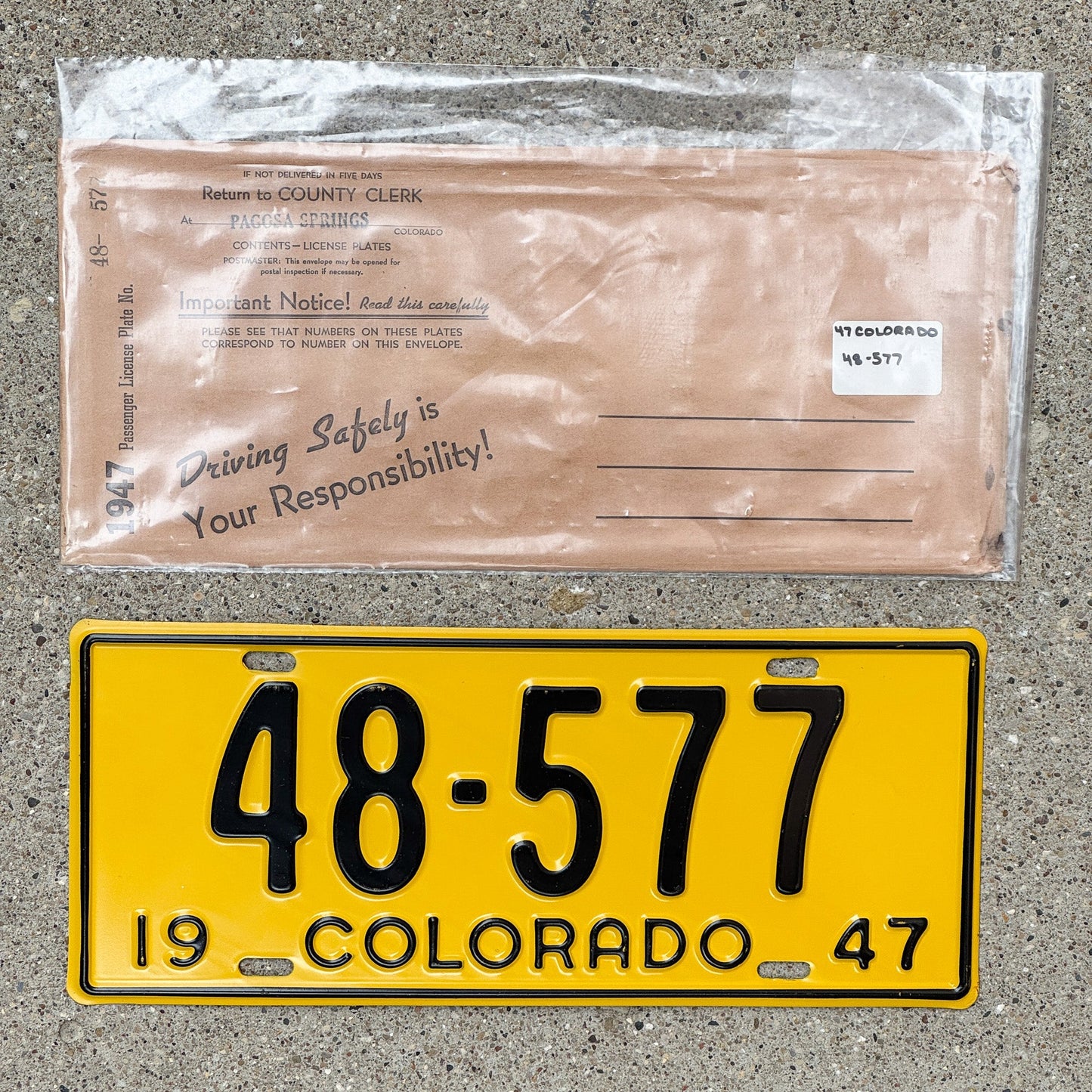 Photo of a 1947 Colorado License Plate Auto Tag Garage Decor Vintage With Envelope High Quality 48 577 with original patina