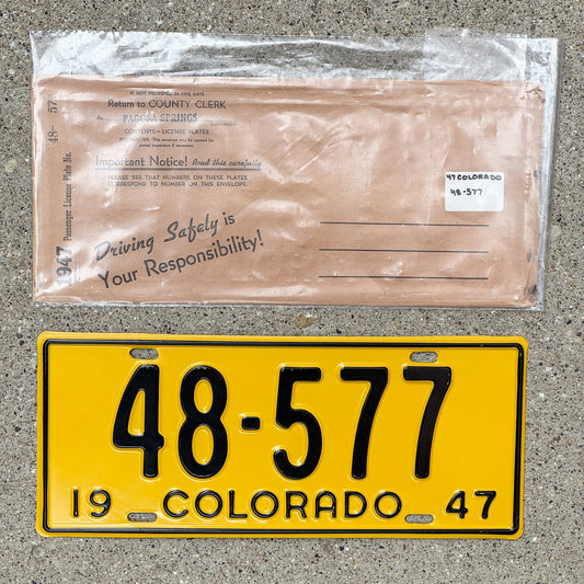 Photo of a 1947 Colorado License Plate Auto Tag Garage Decor Vintage With Envelope High Quality 48 577 with original patina