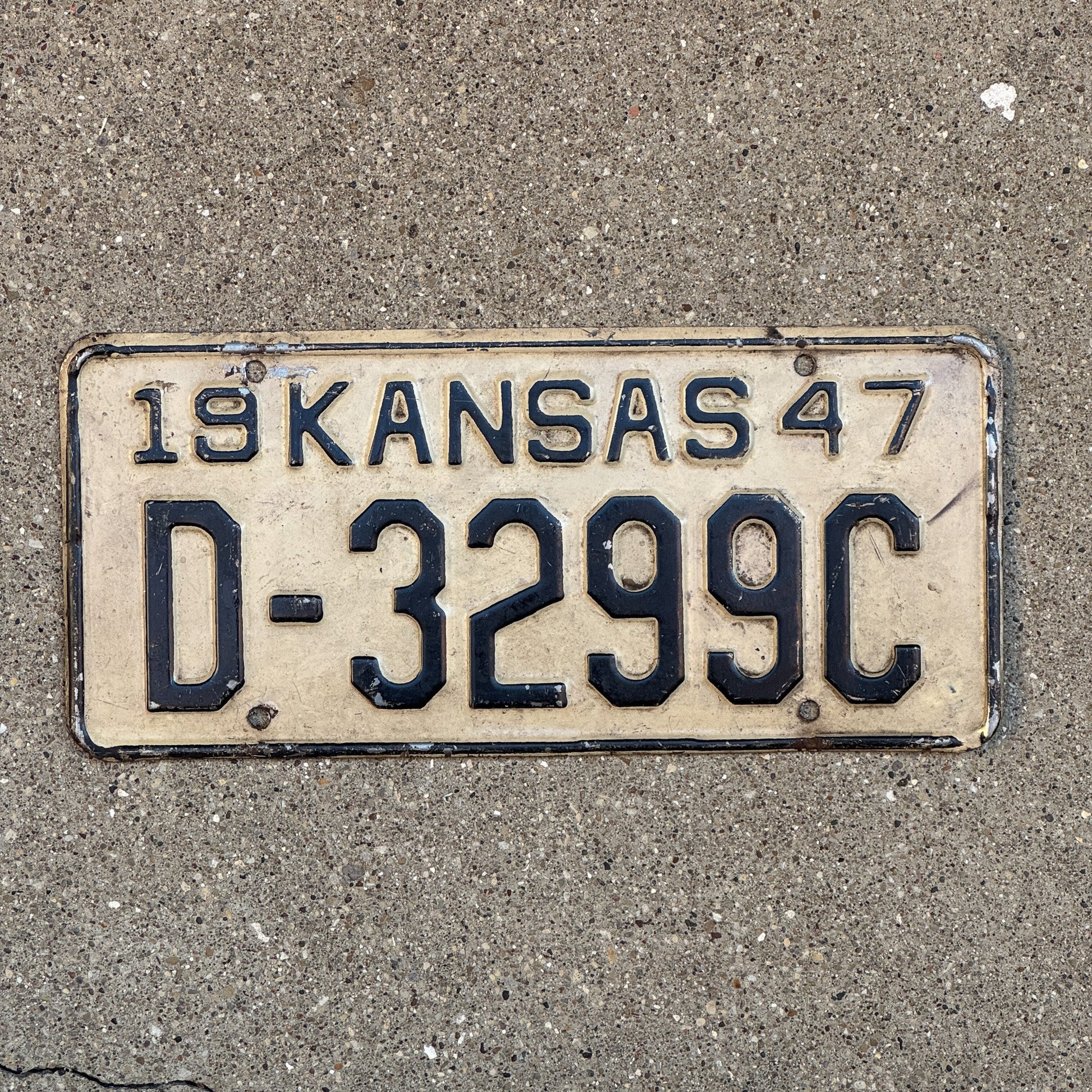 Photo of a 1947 Kansas Dealer License Plate Auto Tag Garage Decor Vintage D 3299 C with original patina