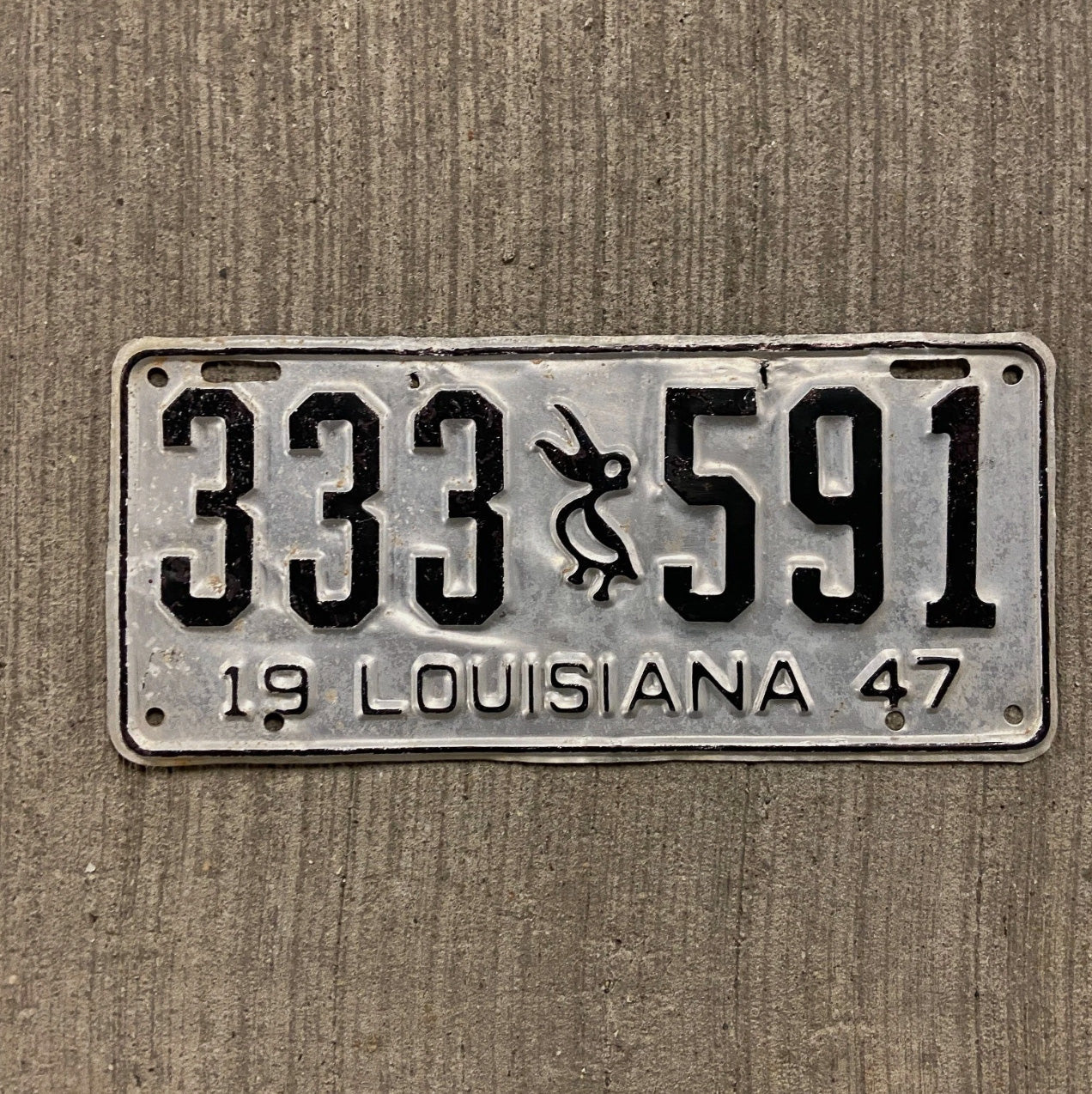 Photo of a 1947 Louisiana License Plate Auto Tag Garage Decor Vintage Iconic Pelican Repeat Repeating 333 591 with original patina