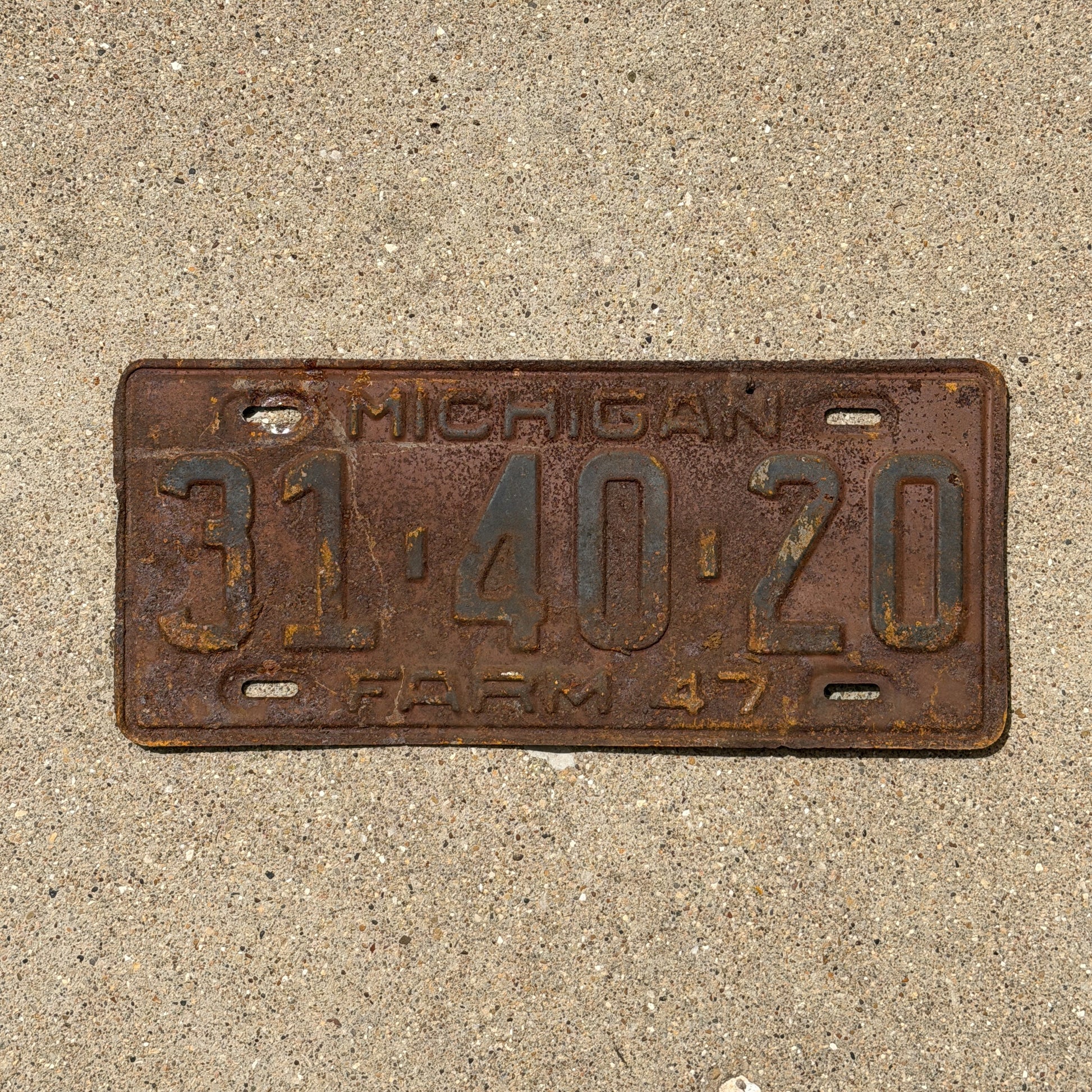 Photo of a 1947 Michigan Farm License Plate Auto Tag Garage Decor Vintage 31 40 20 with original patina