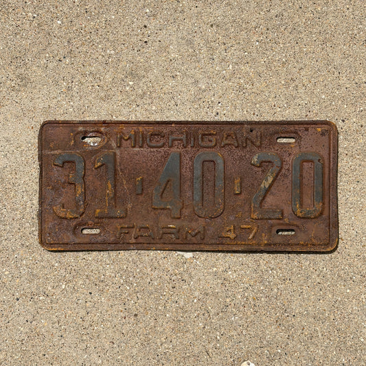 Photo of a 1947 Michigan Farm License Plate Auto Tag Garage Decor Vintage 31 40 20 with original patina