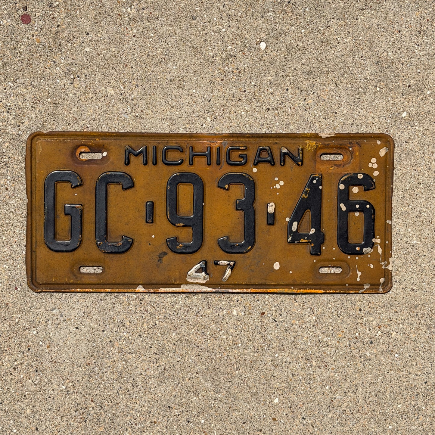 Photo of a 1947 Michigan License Plate Auto Tag Garage Decor Vintage GC 93 46 with original patina