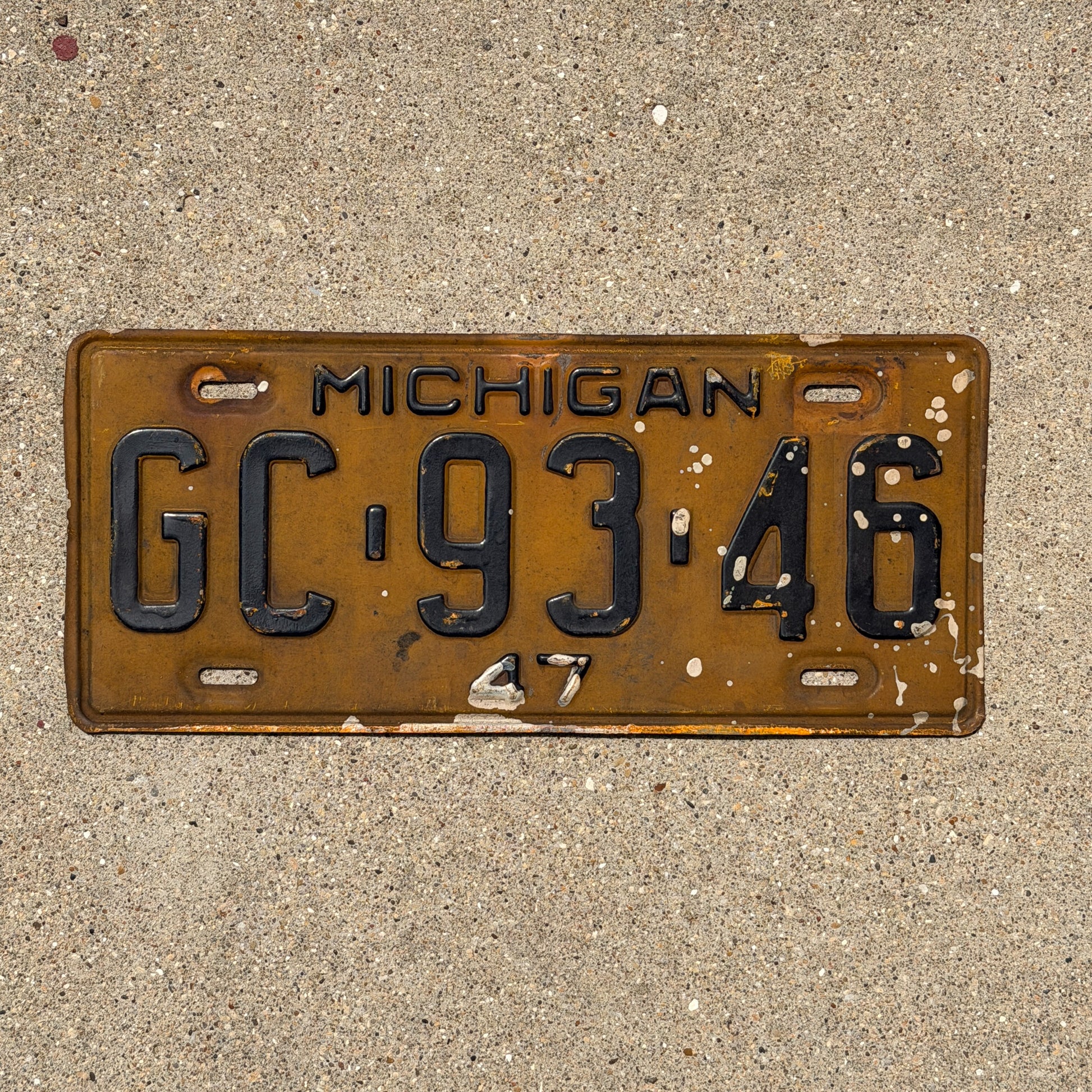 Photo of a 1947 Michigan License Plate Auto Tag Garage Decor Vintage GC 93 46 with original patina