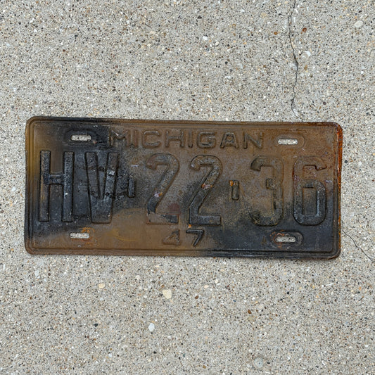 Photo of a 1947 Michigan License Plate Auto Tag Garage Decor Vintage HV 22 36 with original patina