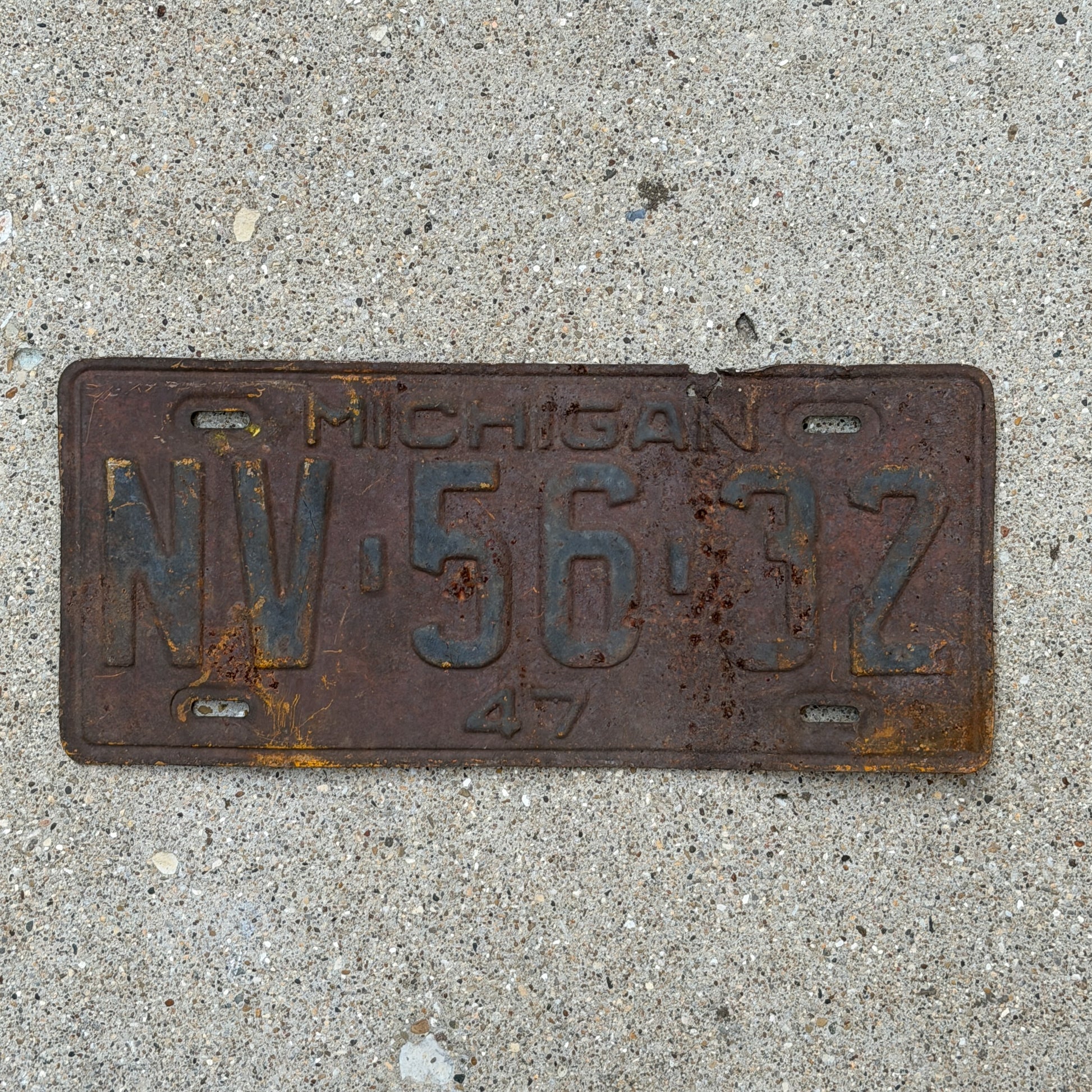 Photo of a 1947 Michigan License Plate Auto Tag Garage Decor Vintage NV 56 32 with original patina