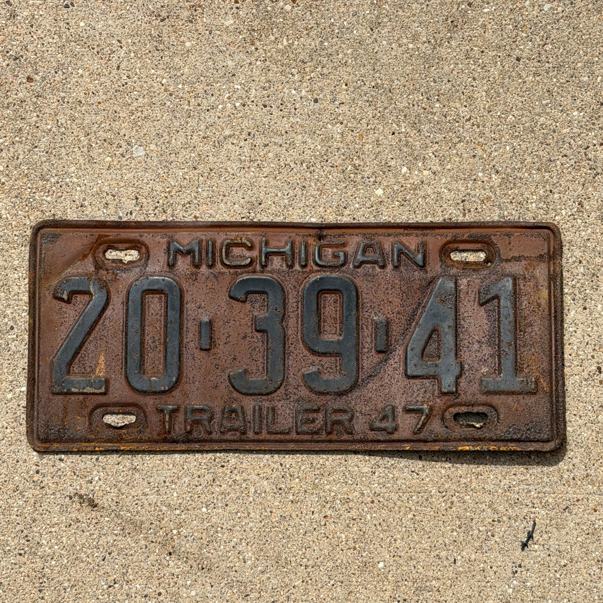 Photo of a 1947 Michigan Trailer License Plate Auto Tag Garage Decor Vintage 20 39 41 with original patina