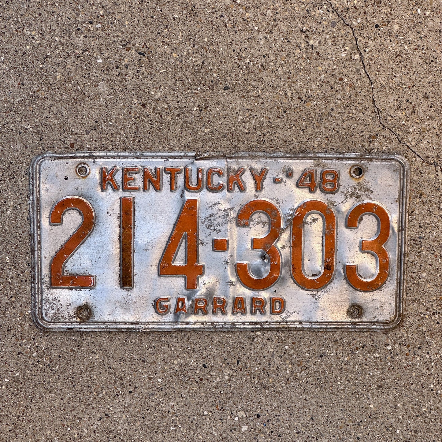 Photo of a 1948 Kentucky License Plate Auto Tag Garage Decor Vintage Garrad County 214 303 with original patina