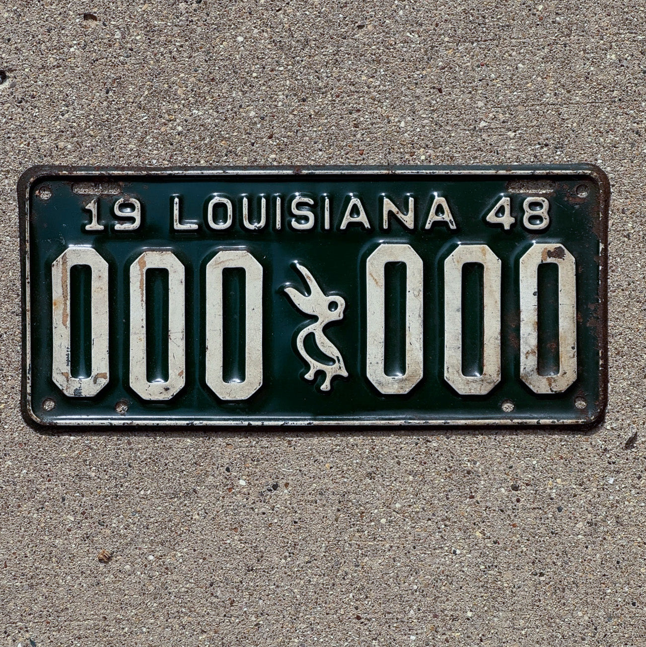 Photo of a 1948 Louisiana Sample License Plate Auto Tag Garage Decor Vintage Iconic Pelicn 000 000 with original patina