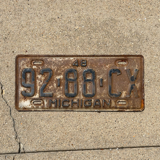 Photo of a 1948 Michigan Commercial License Plate Auto Tag Garage Decor Vintage 92 88 CX with original patina