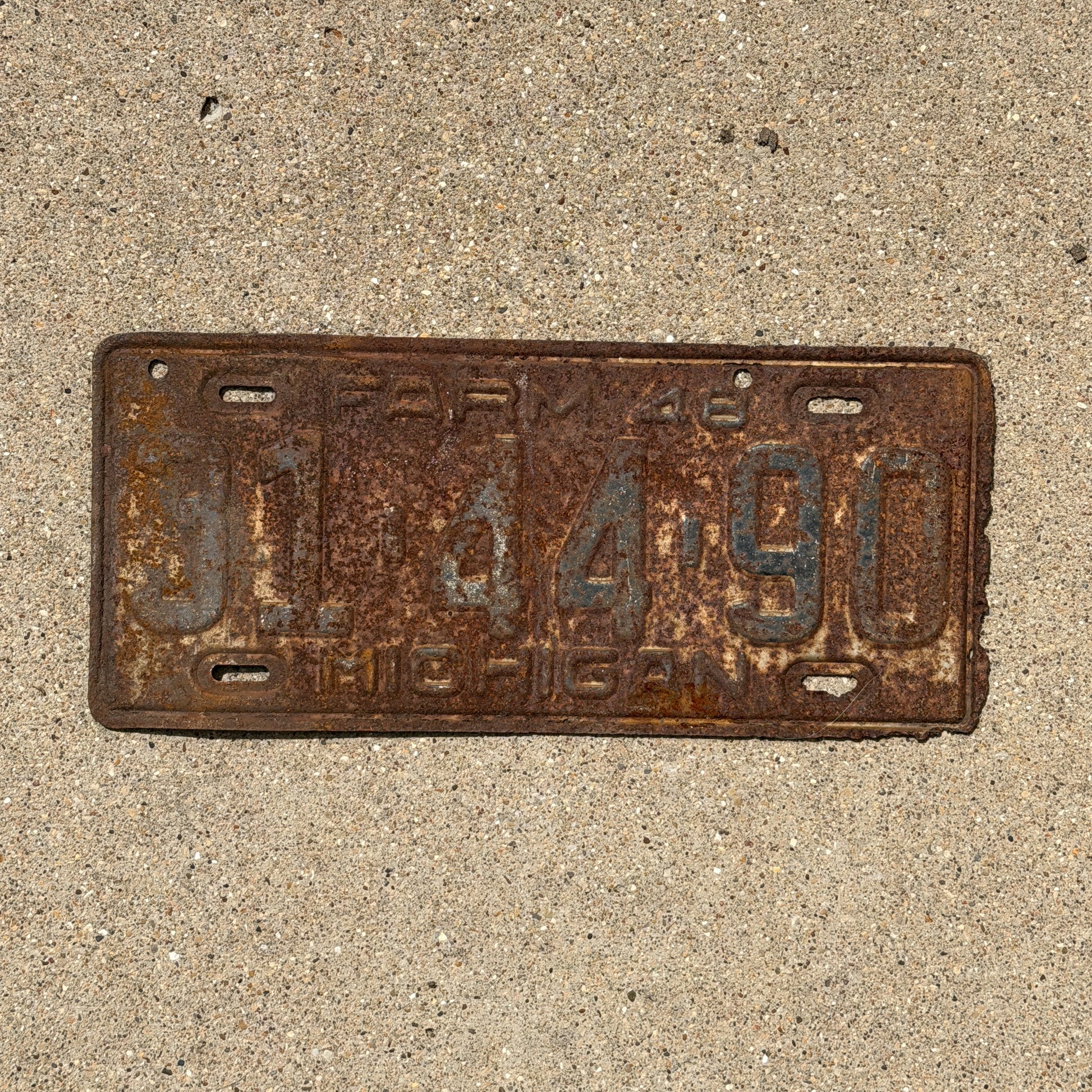 Photo of a 1948 Michigan Farm License Plate Auto Tag Garage Decor Vintage 31 44 90 with original patina